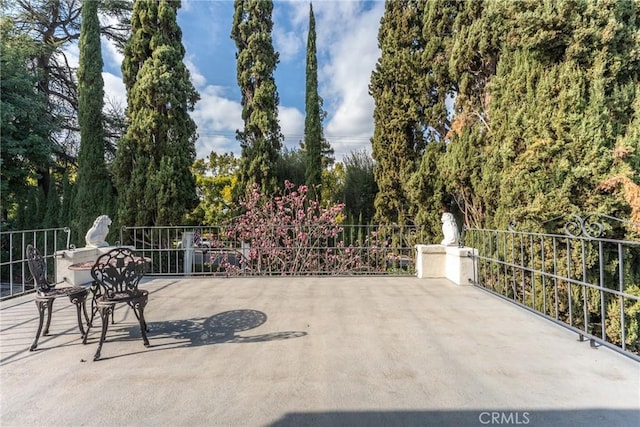 1205 W Highland Ave, Redlands, CA 92373 - view of patio / terrace featuring view of wooded area