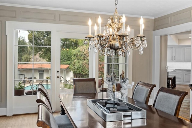 1205 W Highland Ave, Redlands, CA 92373 - dining space featuring a chandelier, crown molding, and wood finished floors