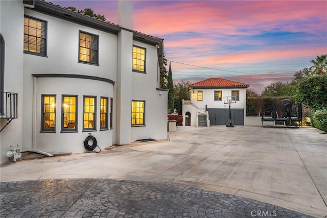 1205 W Highland Ave, Redlands, CA 92373 - back of property at dusk with stucco siding
