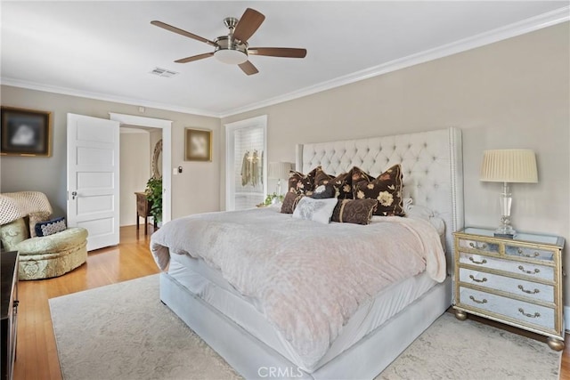 1205 W Highland Ave, Redlands, CA 92373 - bedroom featuring crown molding, wood finished floors, and a ceiling fan