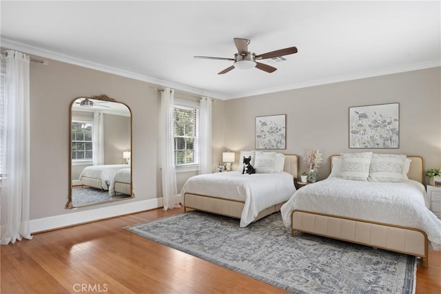 1205 W Highland Ave, Redlands, CA 92373 - bedroom featuring wood finished floors, ornamental molding, baseboards, and a ceiling fan
