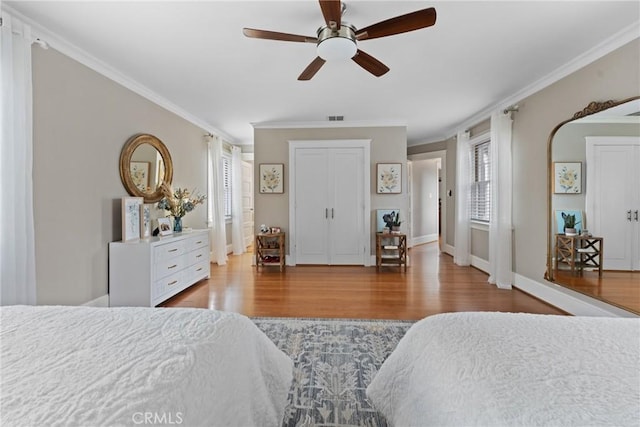 1205 W Highland Ave, Redlands, CA 92373 - bedroom with wood finished floors, ornamental molding, baseboards, and a ceiling fan