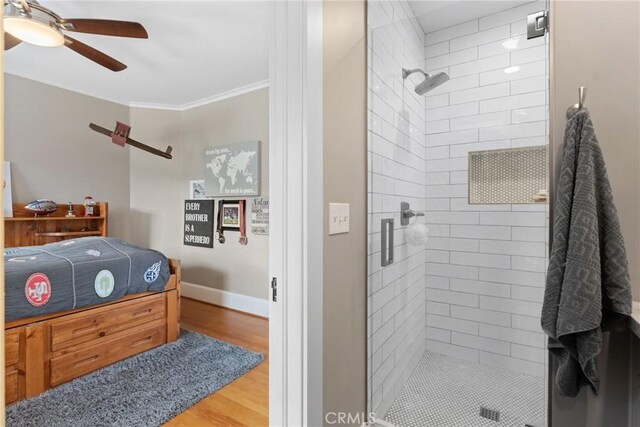 1205 W Highland Ave, Redlands, CA 92373 - bathroom featuring ceiling fan, a stall shower, wood finished floors, ornamental molding, and baseboards