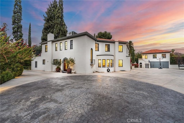 1205 W Highland Ave, Redlands, CA 92373 - mediterranean / spanish-style house with a chimney and stucco siding