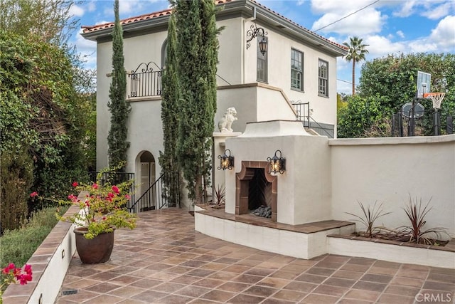 1205 W Highland Ave, Redlands, CA 92373 - view of patio with a tiled fireplace