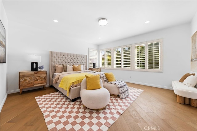 bedroom featuring recessed lighting, baseboards, and wood finished floors