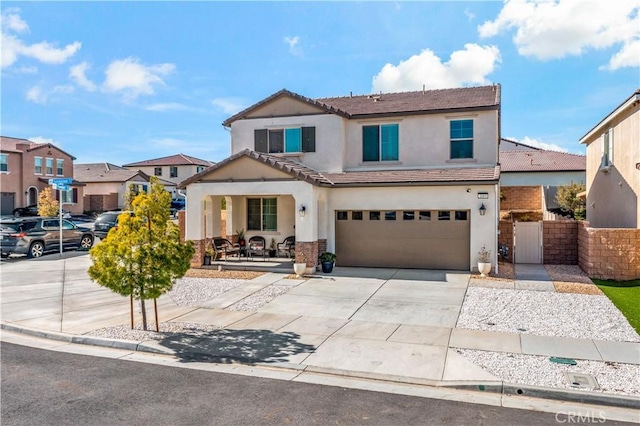 traditional-style home with cooling unit, fence, driveway, stucco siding, and a garage