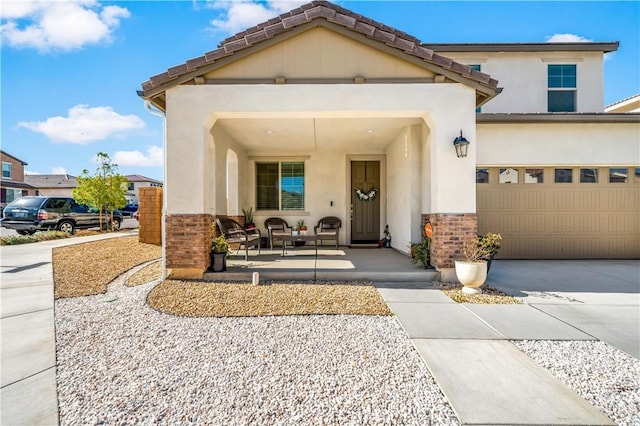 property entrance with a garage and a porch