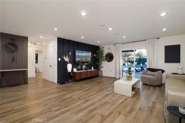 living room with light hardwood / wood-style flooring