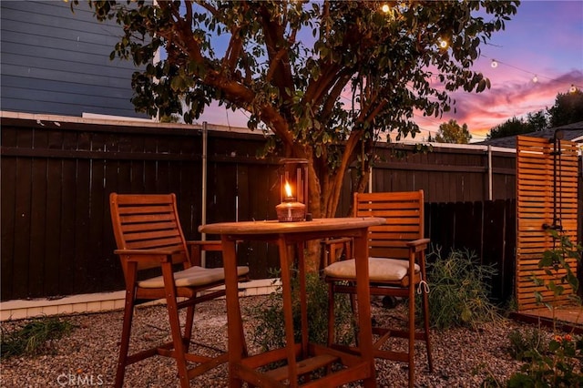 view of patio terrace at dusk