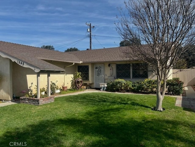 ranch-style home with a front yard