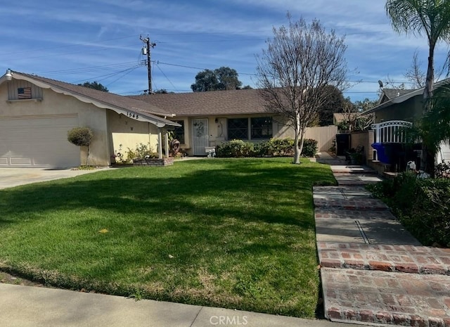 single story home with a front yard and a garage