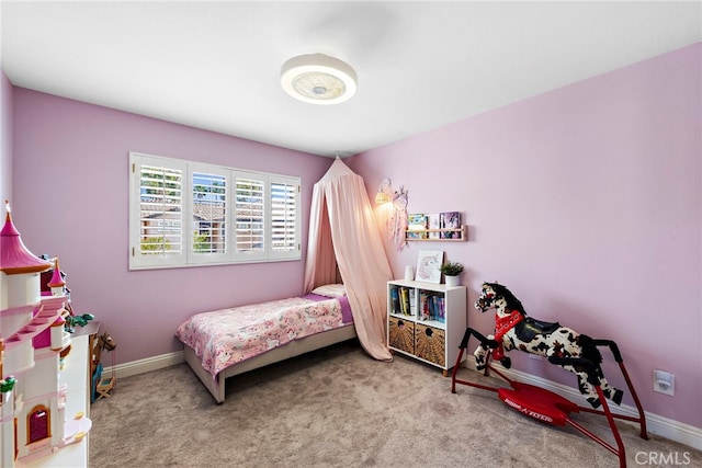 carpeted bedroom with baseboards