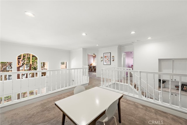 living area featuring recessed lighting, ornamental molding, carpet flooring, and an upstairs landing