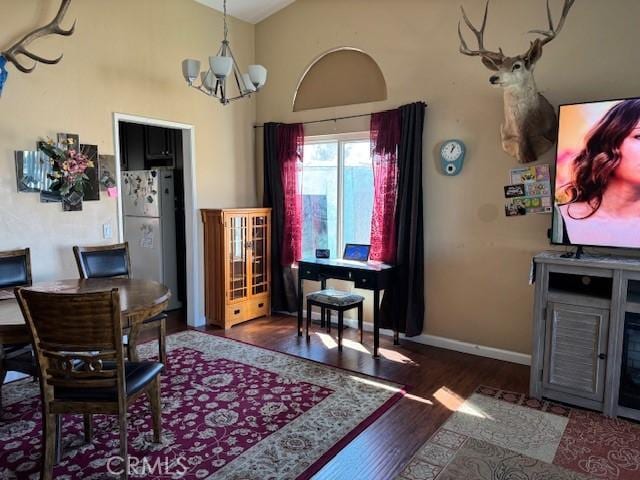 dining room with baseboards, high vaulted ceiling, dark wood-style flooring, and a notable chandelier