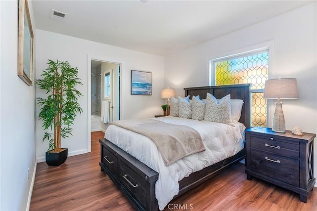 bedroom with visible vents, baseboards, and dark wood-type flooring