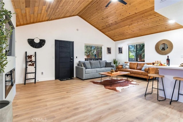 living room with high vaulted ceiling, light hardwood / wood-style flooring, ceiling fan, and wooden ceiling