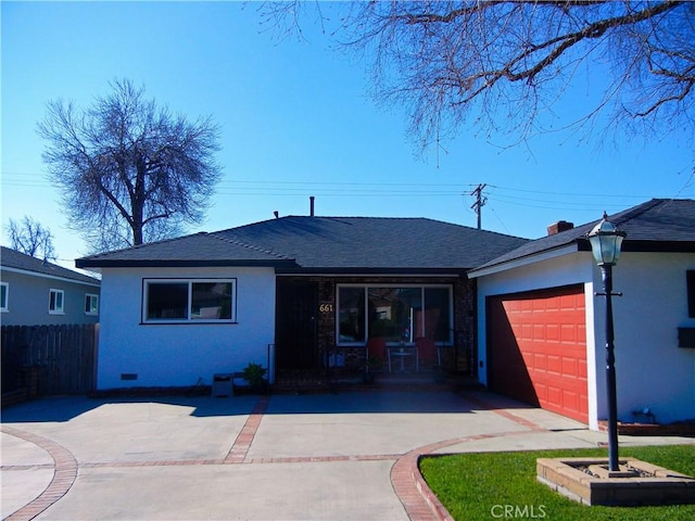 single story home with an attached garage, driveway, fence, and stucco siding