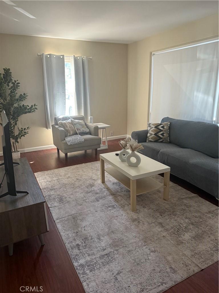 living room featuring dark hardwood / wood-style floors