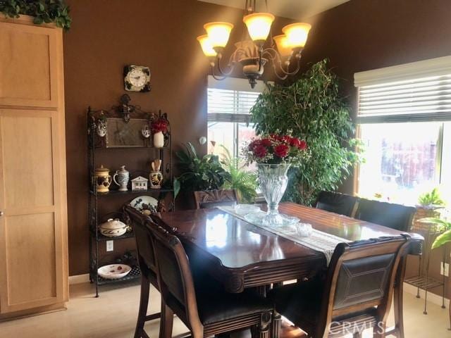 dining area featuring an inviting chandelier