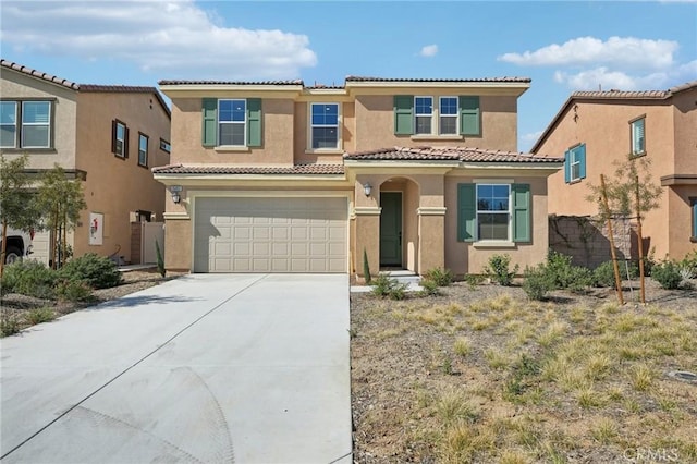 mediterranean / spanish home featuring driveway, a tile roof, a garage, and stucco siding