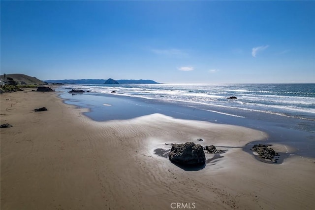 property view of water featuring a beach view