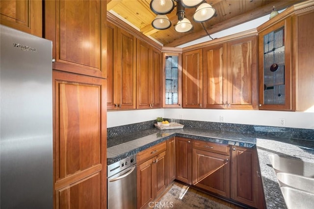 kitchen featuring stainless steel fridge, an inviting chandelier, sink, wooden ceiling, and dark stone counters