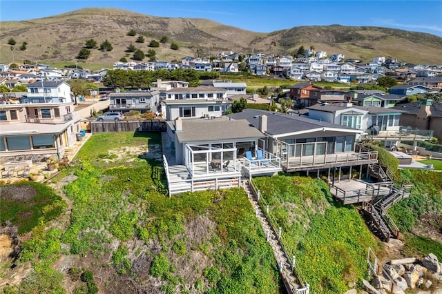 birds eye view of property with a mountain view