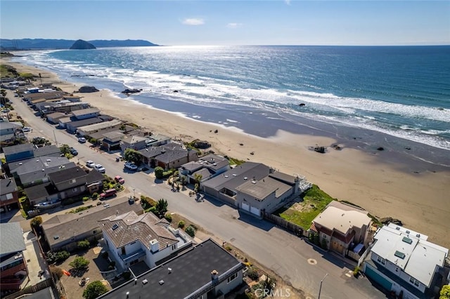 aerial view featuring a water view and a view of the beach