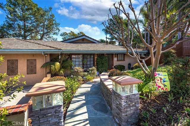 view of front of home with a patio area