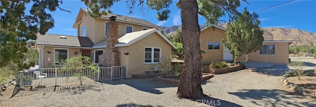 view of front of home featuring a mountain view