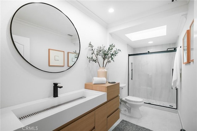 bathroom with an enclosed shower, tile patterned flooring, toilet, a skylight, and vanity