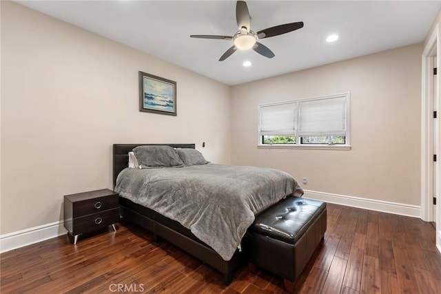 bedroom with ceiling fan and dark hardwood / wood-style flooring