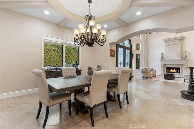 dining area featuring beamed ceiling