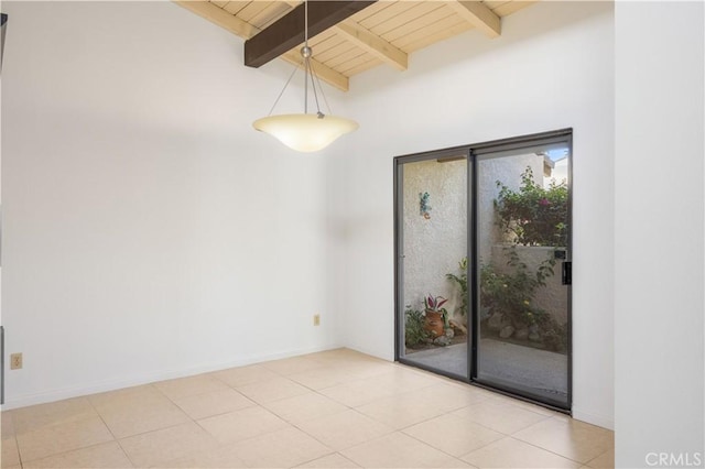 1150 E Palm Canyon Dr Unit 51, Palm Springs, CA 92264 - unfurnished room with wood ceiling with exposed beams, tile patterned flooring, and baseboards