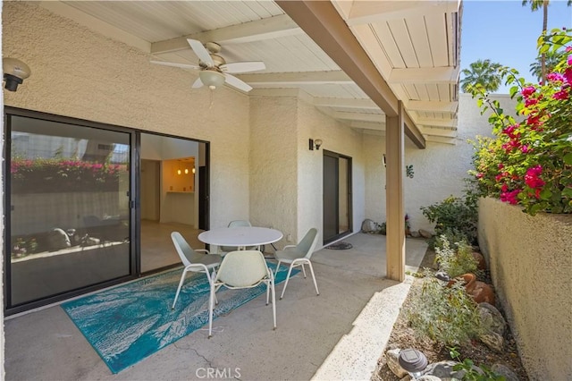 1150 E Palm Canyon Dr Unit 51, Palm Springs, CA 92264 - view of patio with ceiling fan and outdoor dining area