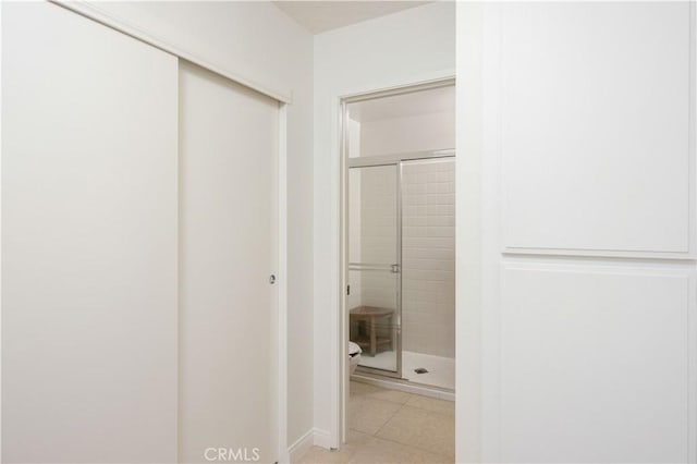 1150 E Palm Canyon Dr Unit 51, Palm Springs, CA 92264 - hallway with light tile patterned flooring and baseboards