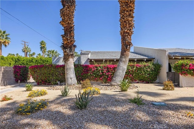 1150 E Palm Canyon Dr Unit 51, Palm Springs, CA 92264 - view of front facade featuring a tiled roof and stucco siding