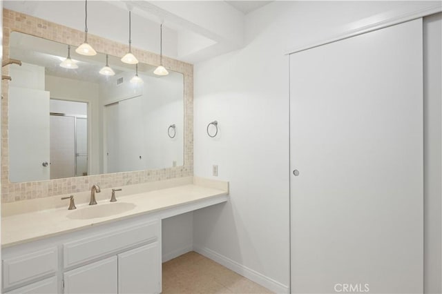 1150 E Palm Canyon Dr Unit 51, Palm Springs, CA 92264 - full bathroom featuring vanity, baseboards, and a shower with shower door