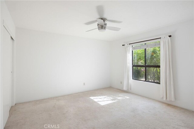 1150 E Palm Canyon Dr Unit 51, Palm Springs, CA 92264 - unfurnished bedroom with light colored carpet and ceiling fan
