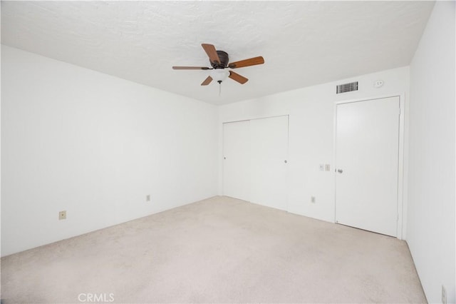 1150 E Palm Canyon Dr Unit 51, Palm Springs, CA 92264 - unfurnished bedroom with carpet flooring, a closet, and ceiling fan