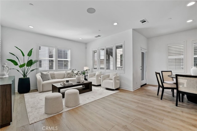 living room with light hardwood / wood-style floors