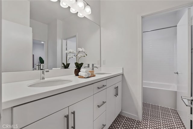 bathroom featuring shower / tub combination and vanity