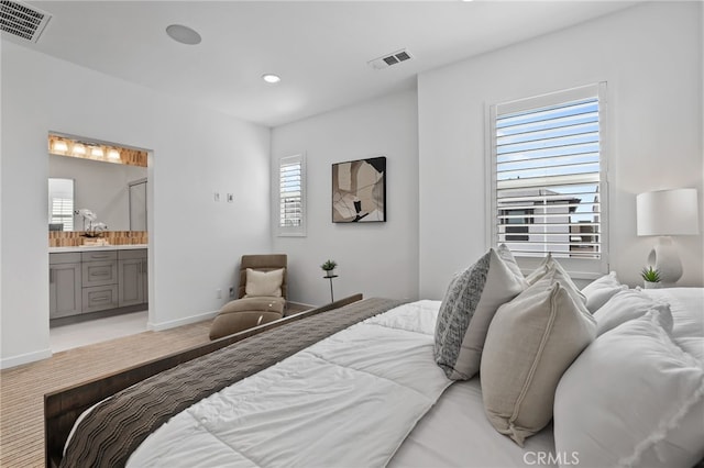 bedroom featuring ensuite bath