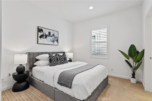 bedroom with light hardwood / wood-style flooring