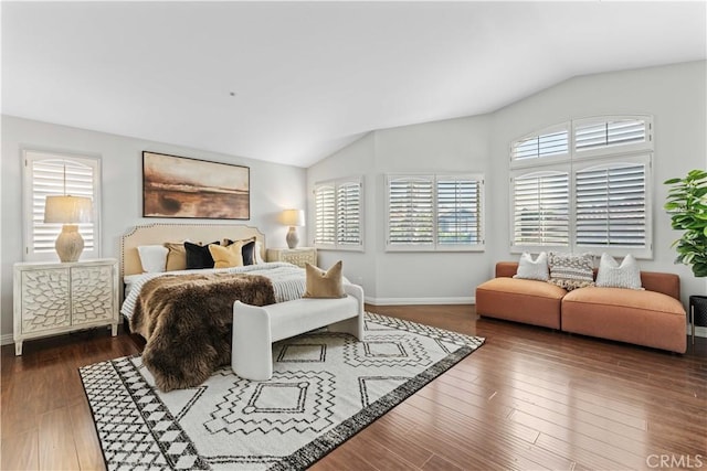 bedroom featuring dark hardwood / wood-style floors and lofted ceiling