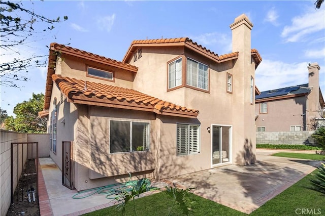 back of property featuring a patio area