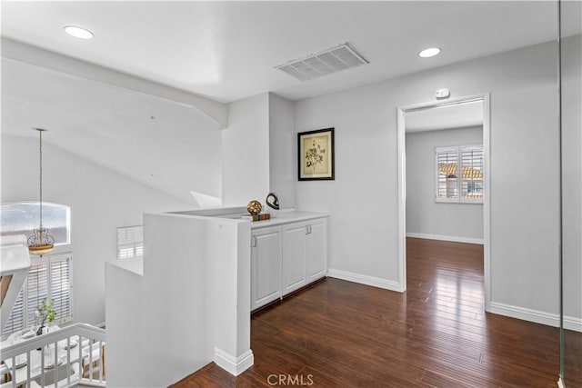 hallway with dark wood-type flooring