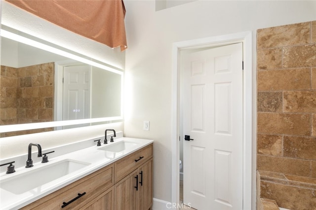 bathroom featuring toilet and vanity