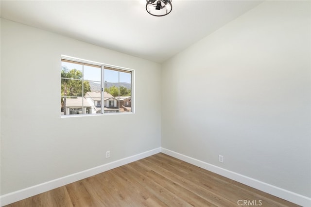 unfurnished room featuring hardwood / wood-style flooring